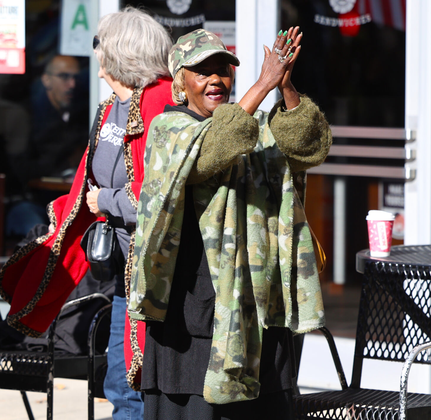 Woman claps after National Anthem.JPG
